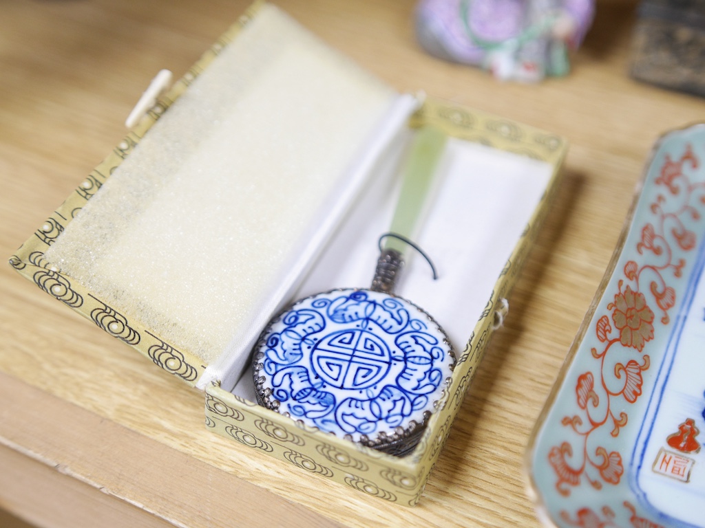 A group of Chinese and Japanese items to include silvered dragon box, hand mirror and square dish. Condition - varies